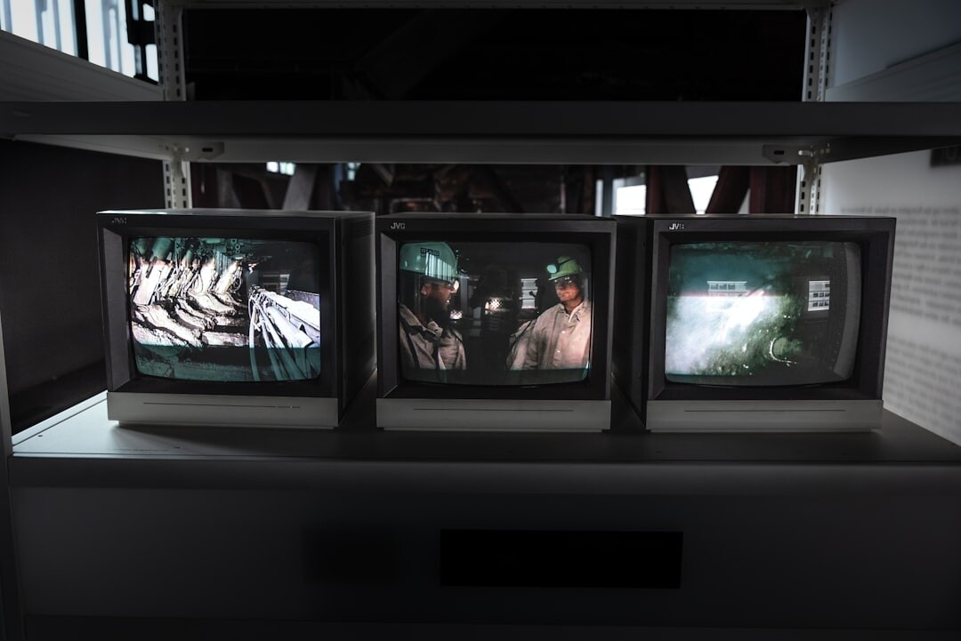 Television control room with multiple monitors showing live camera feeds