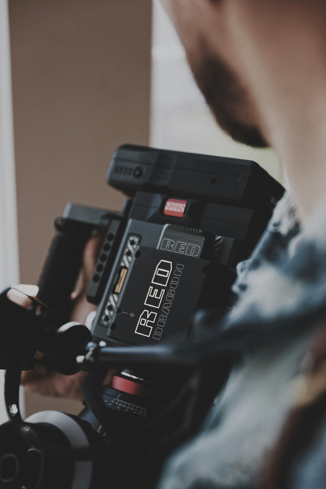 Camera operator looking through a broadcast television camera
