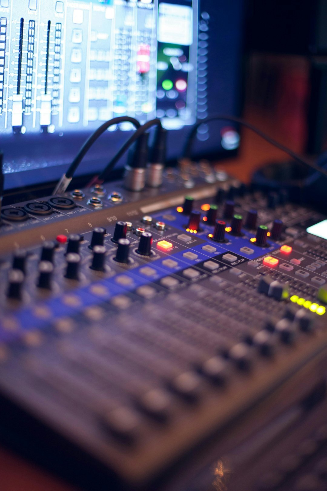 Team of production professionals working together at a control desk